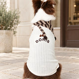 Back view of the cream pet knit showing DORIS embroidery and a small brown bow, styled with a striped bandana.