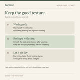 English care instructions for the cream cable-knit pet top.